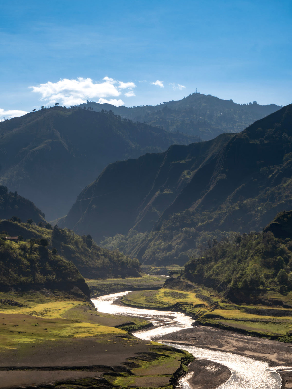 A river valley between green mountains in Huila, Colombia